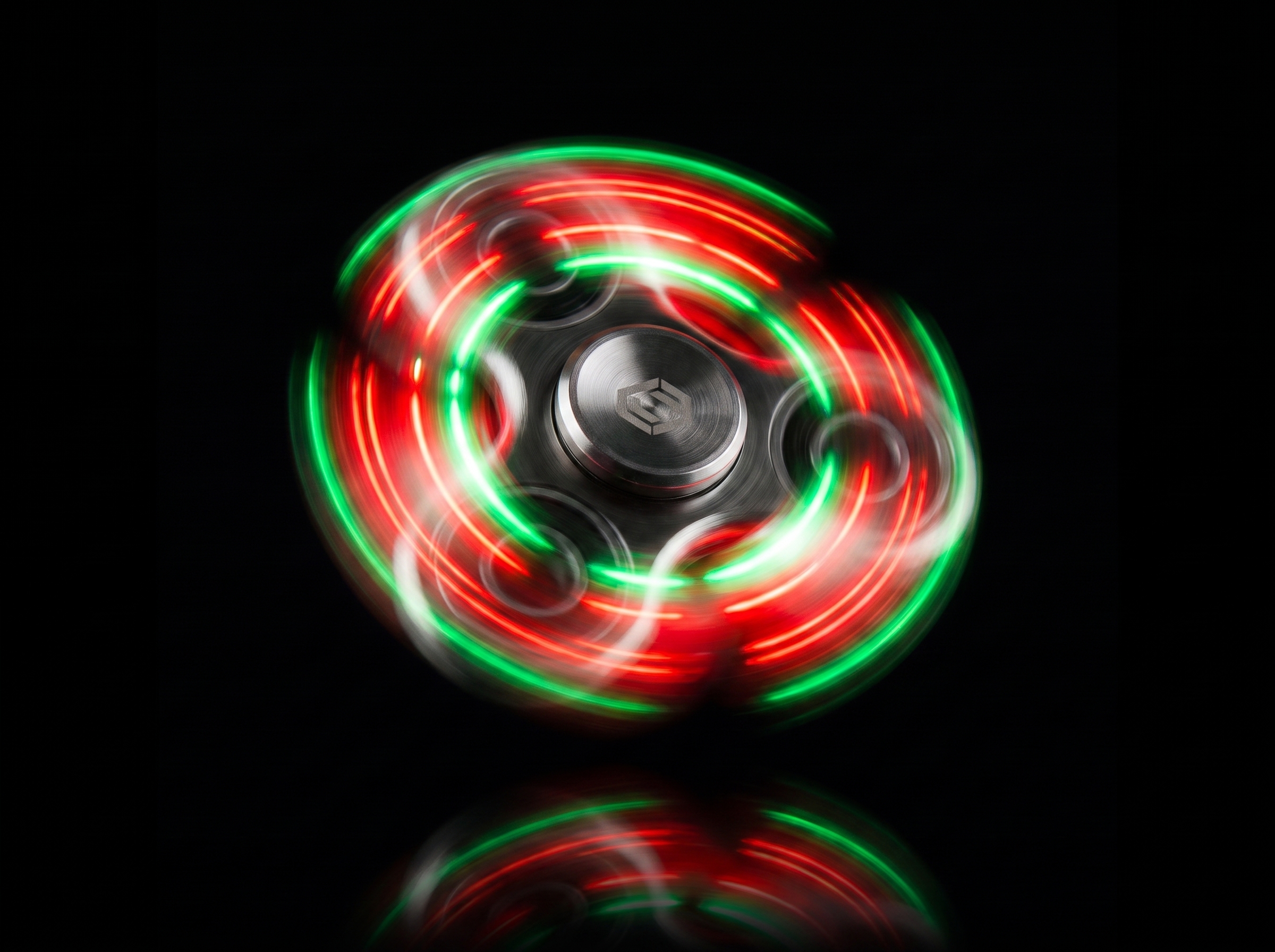 KORVEX LED spinner glowing green, studio product shot